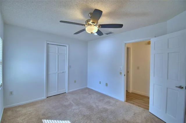 a view of a house with a yard porch and sitting area