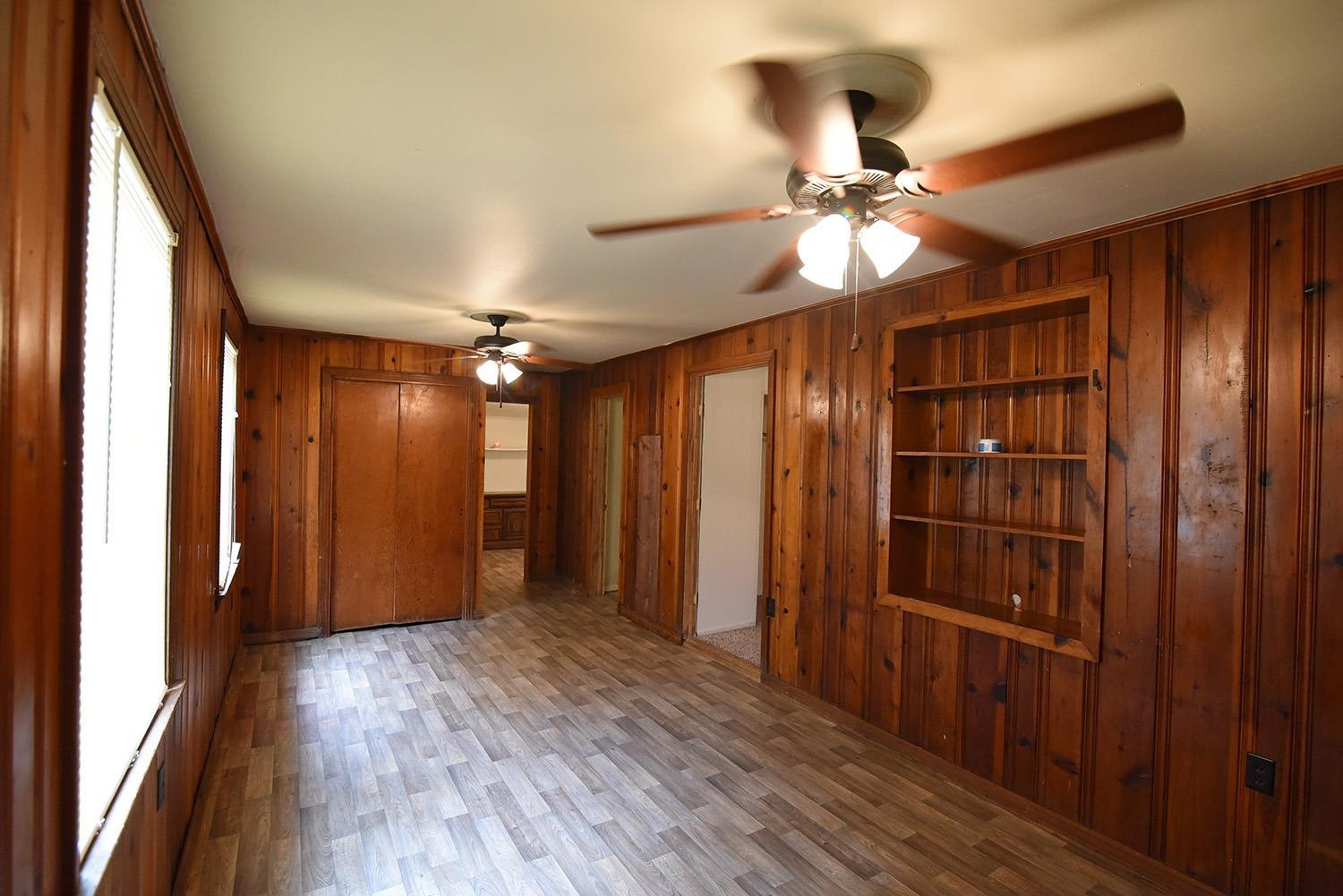 wooden floor in an empty room and a window