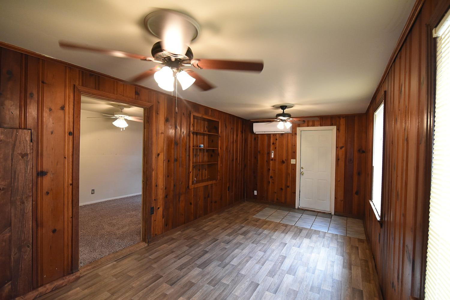 2006 29th Street, Unit REAR Lubbock, TX 79411 - Photo 2 of 10 a view of a livingroom with a chandelier fan and closet area