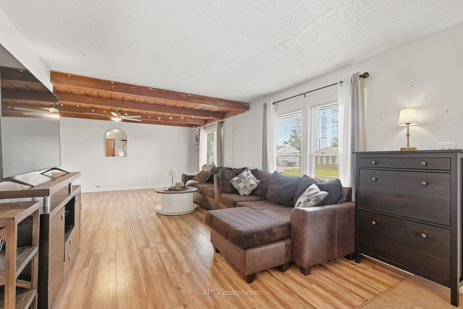 242 Tallman Avenue Romeoville, IL 60446 - Photo 13 of 25 a living room with furniture and a wooden floor