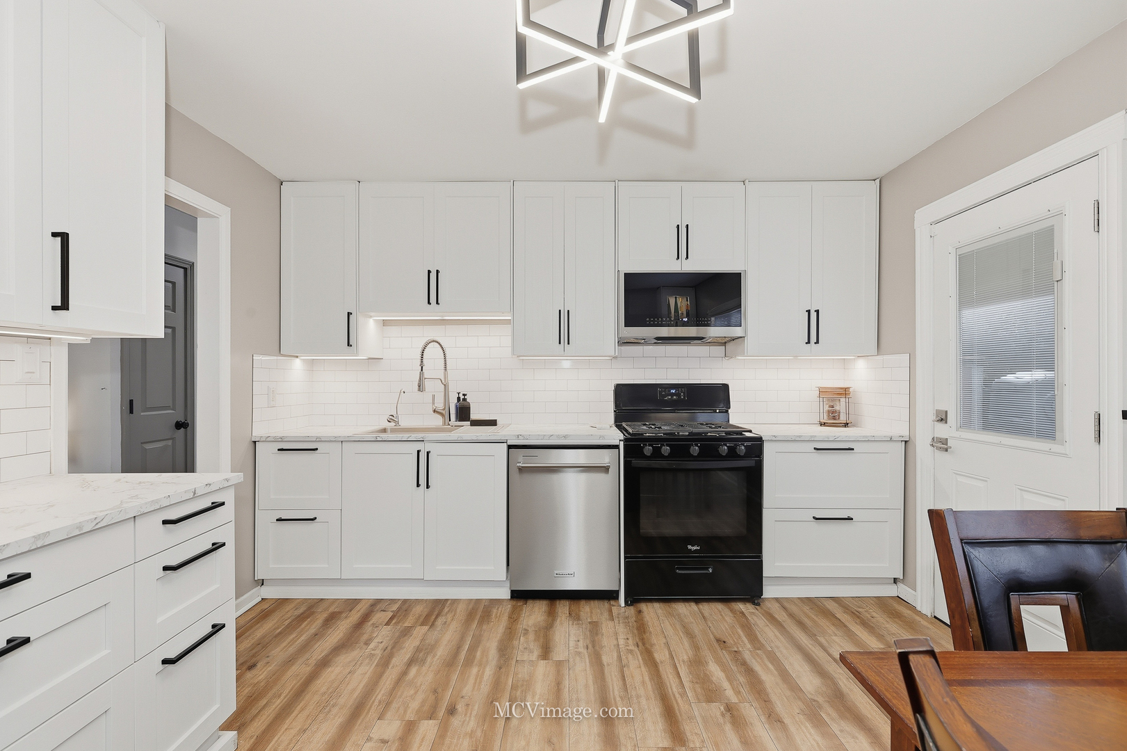 242 Tallman Avenue Romeoville, IL 60446 - Photo 14 of 25 a kitchen with a stove a sink and a refrigerator
