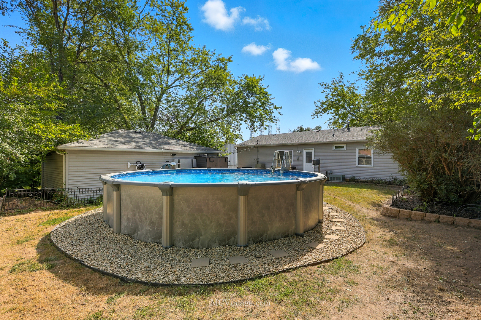 242 Tallman Avenue Romeoville, IL 60446 - Photo 7 of 25 a view of a house with pool