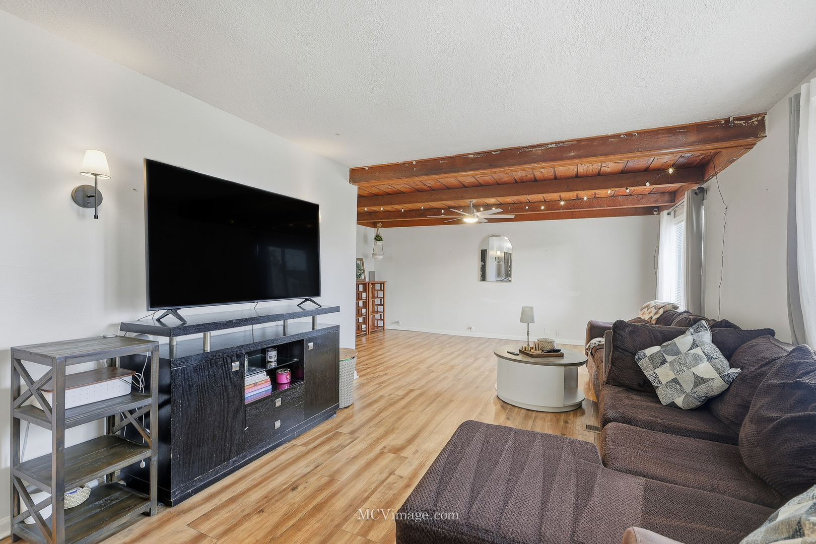 242 Tallman Avenue Romeoville, IL 60446 - Photo 9 of 25 a living room with furniture and a flat screen tv