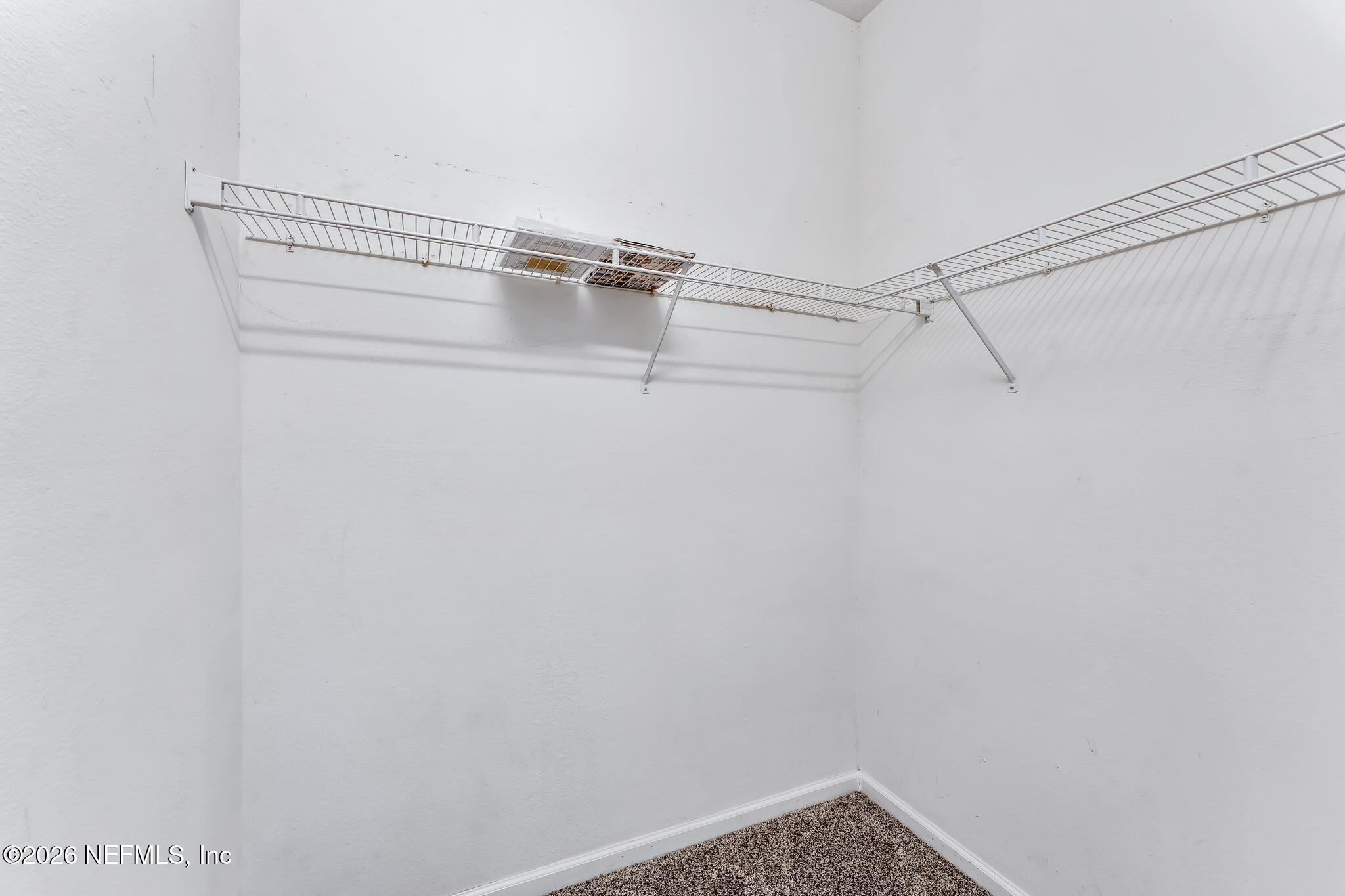 7990 Baymeadows Road East, Unit 520 Jacksonville, FL 32256 - Photo 19 of 41 a view of a room with racks on the wall