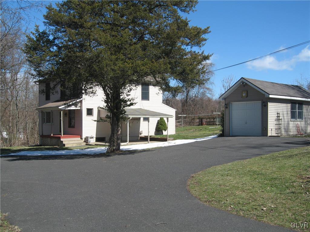 2009 Springtown Hill Road Hellertown, PA 18055 - Photo 2 of 39 front view of a house with a street