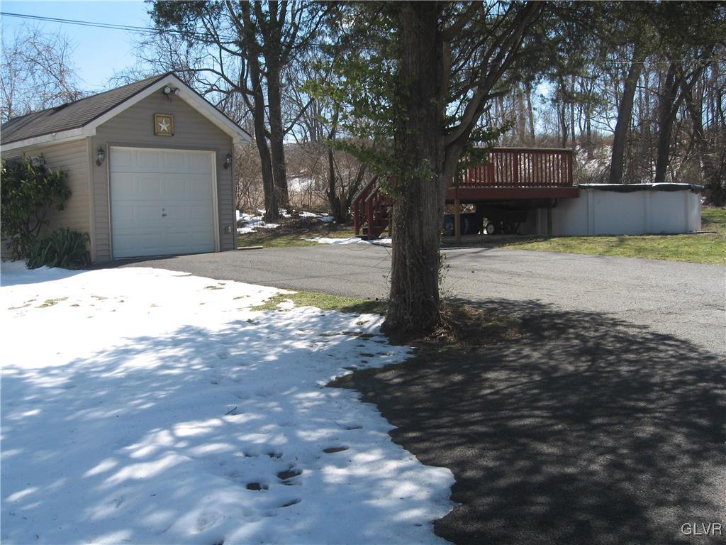 2009 Springtown Hill Road Hellertown, PA 18055 - Photo 3 of 39 a front view of a house with a yard and garage