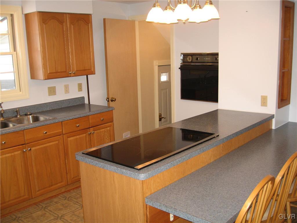 2009 Springtown Hill Road Hellertown, PA 18055 - Photo 4 of 39 a kitchen with stainless steel appliances granite countertop a sink and a refrigerator