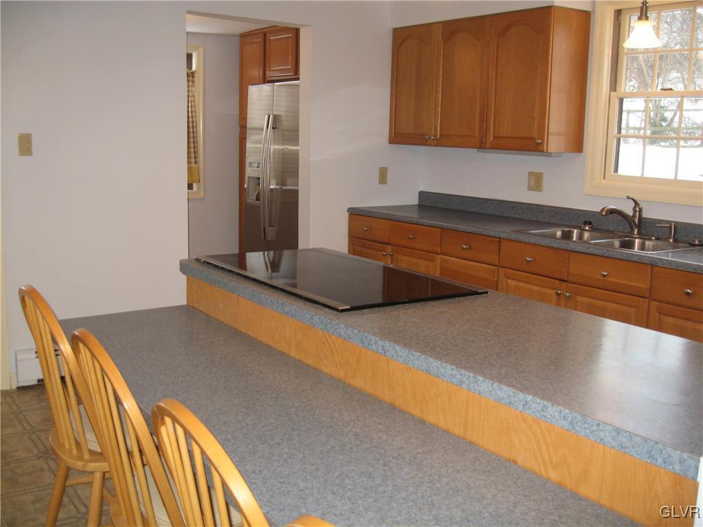 2009 Springtown Hill Road Hellertown, PA 18055 - Photo 7 of 39 a kitchen with stainless steel appliances granite countertop a granite counter tops and a view of living room