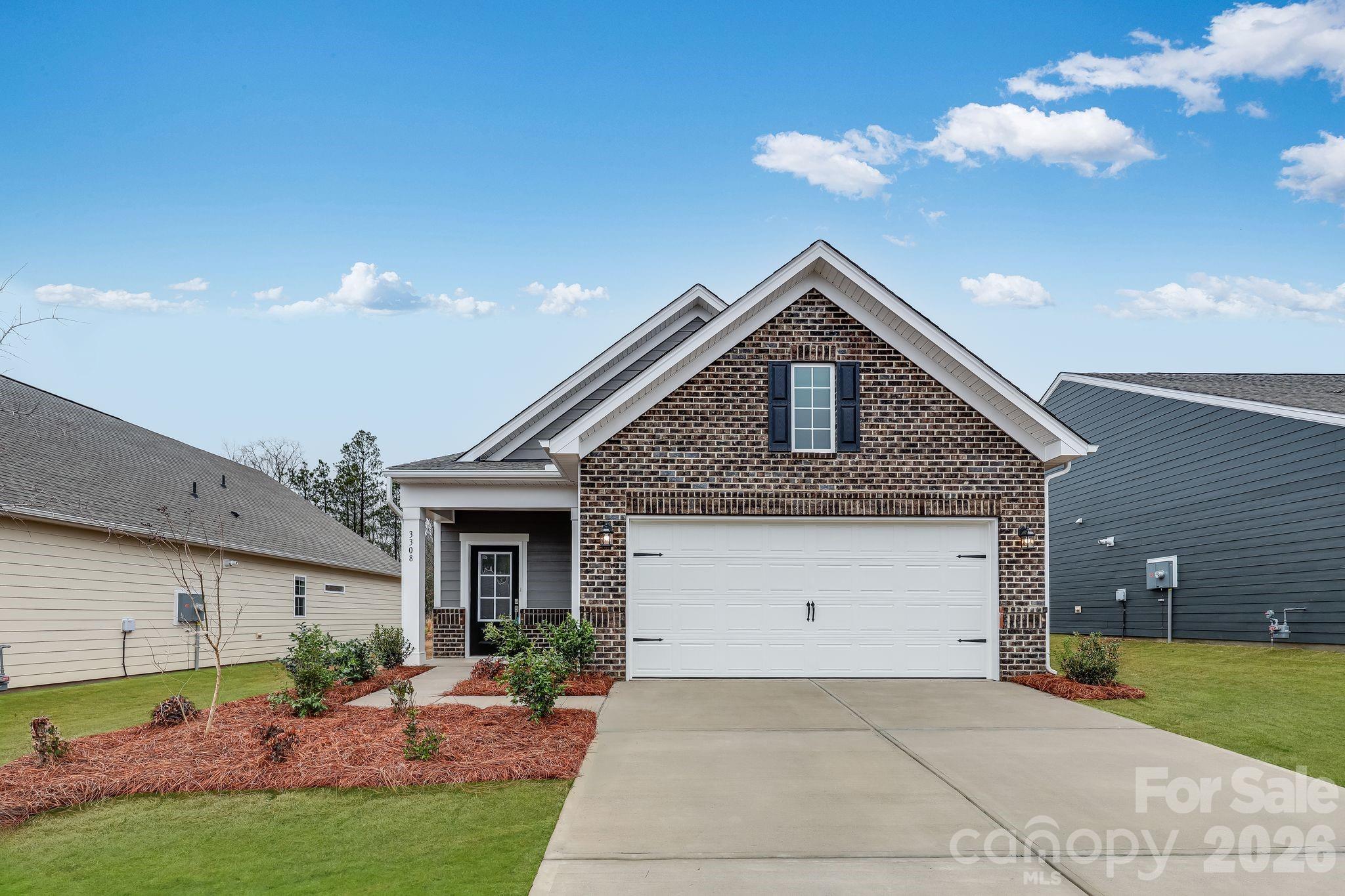 3308 Amarillo Court, Unit 344 Lancaster, SC 29720 - Photo 1 of 27 a front view of a house with garden
