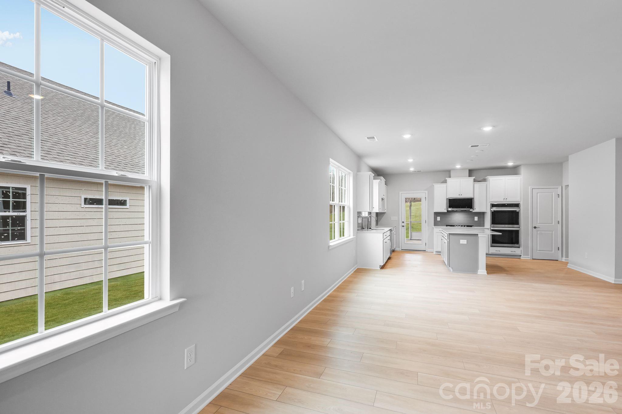 3308 Amarillo Court, Unit 344 Lancaster, SC 29720 - Photo 11 of 27 a view of kitchen with furniture and windows