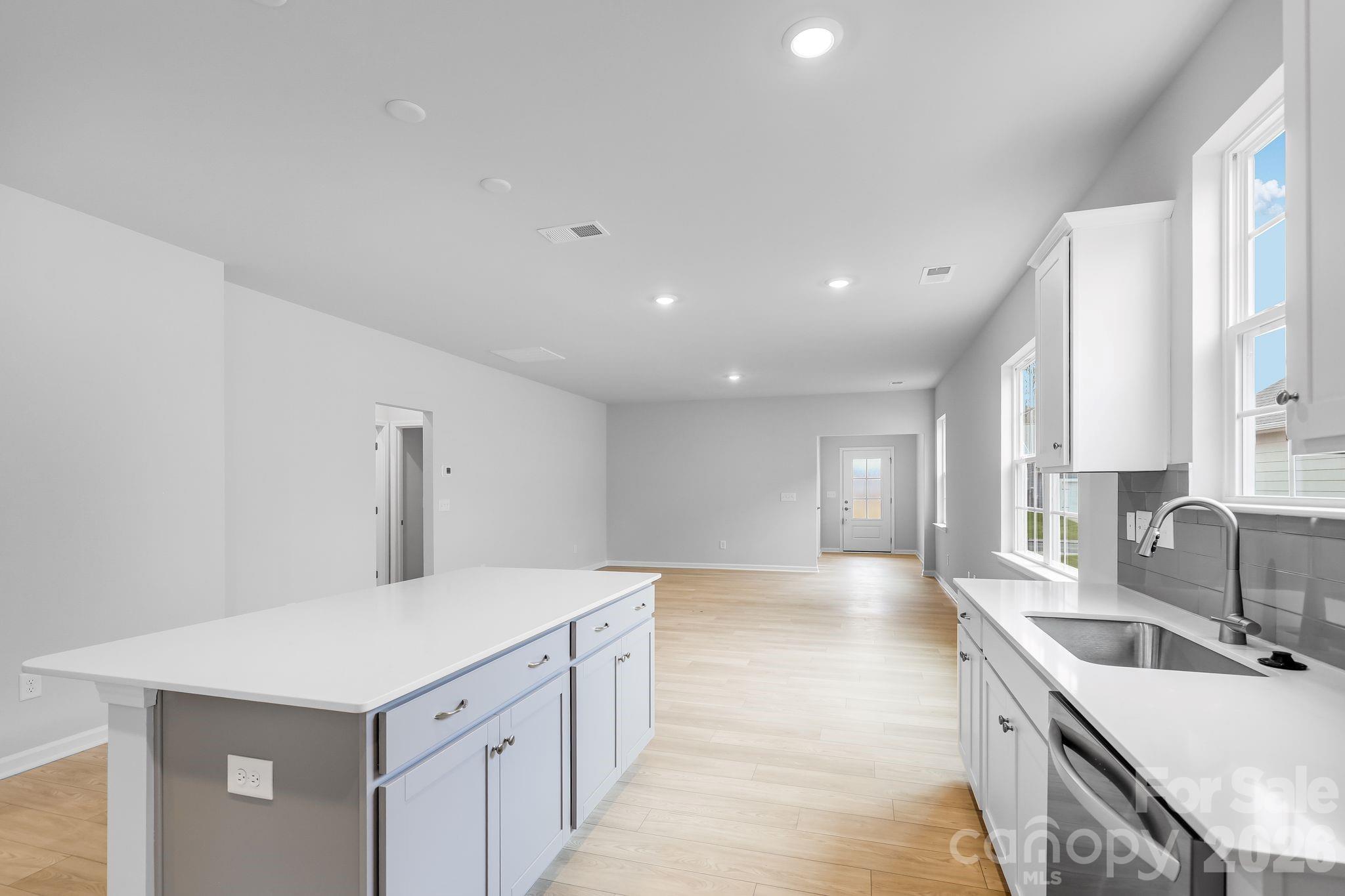 3308 Amarillo Court, Unit 344 Lancaster, SC 29720 - Photo 14 of 27 a kitchen with a sink stove and cabinets