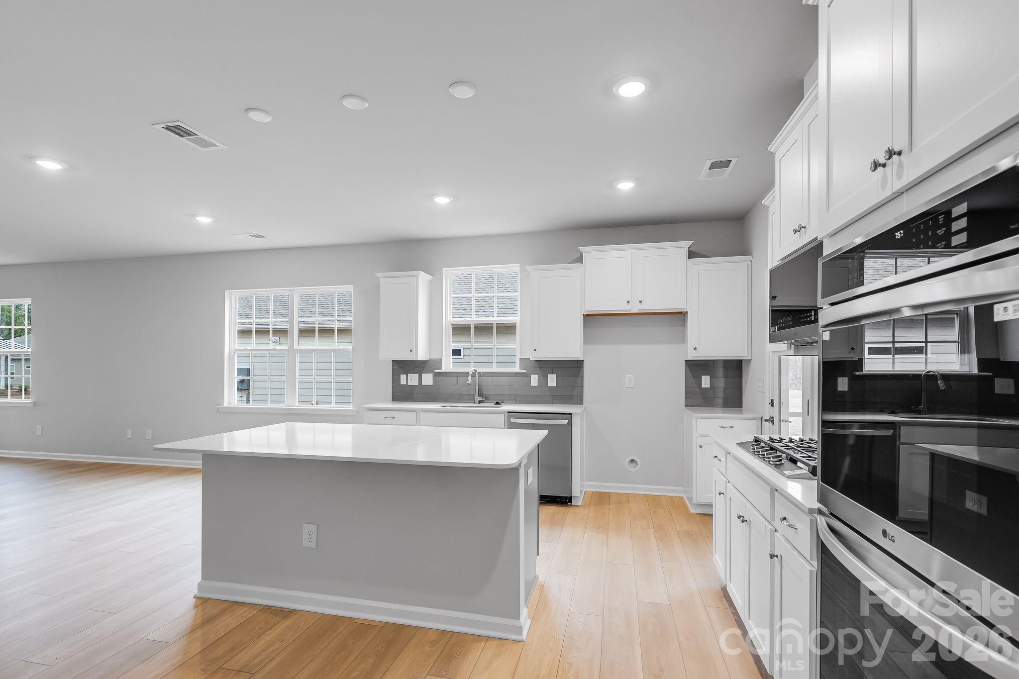 3308 Amarillo Court, Unit 344 Lancaster, SC 29720 - Photo 15 of 27 a large kitchen with stainless steel appliances lots of counter space and a sink