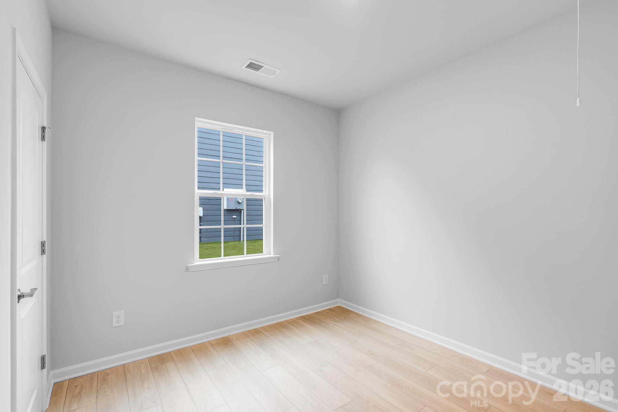 3308 Amarillo Court, Unit 344 Lancaster, SC 29720 - Photo 5 of 27 a view of an empty room with a window