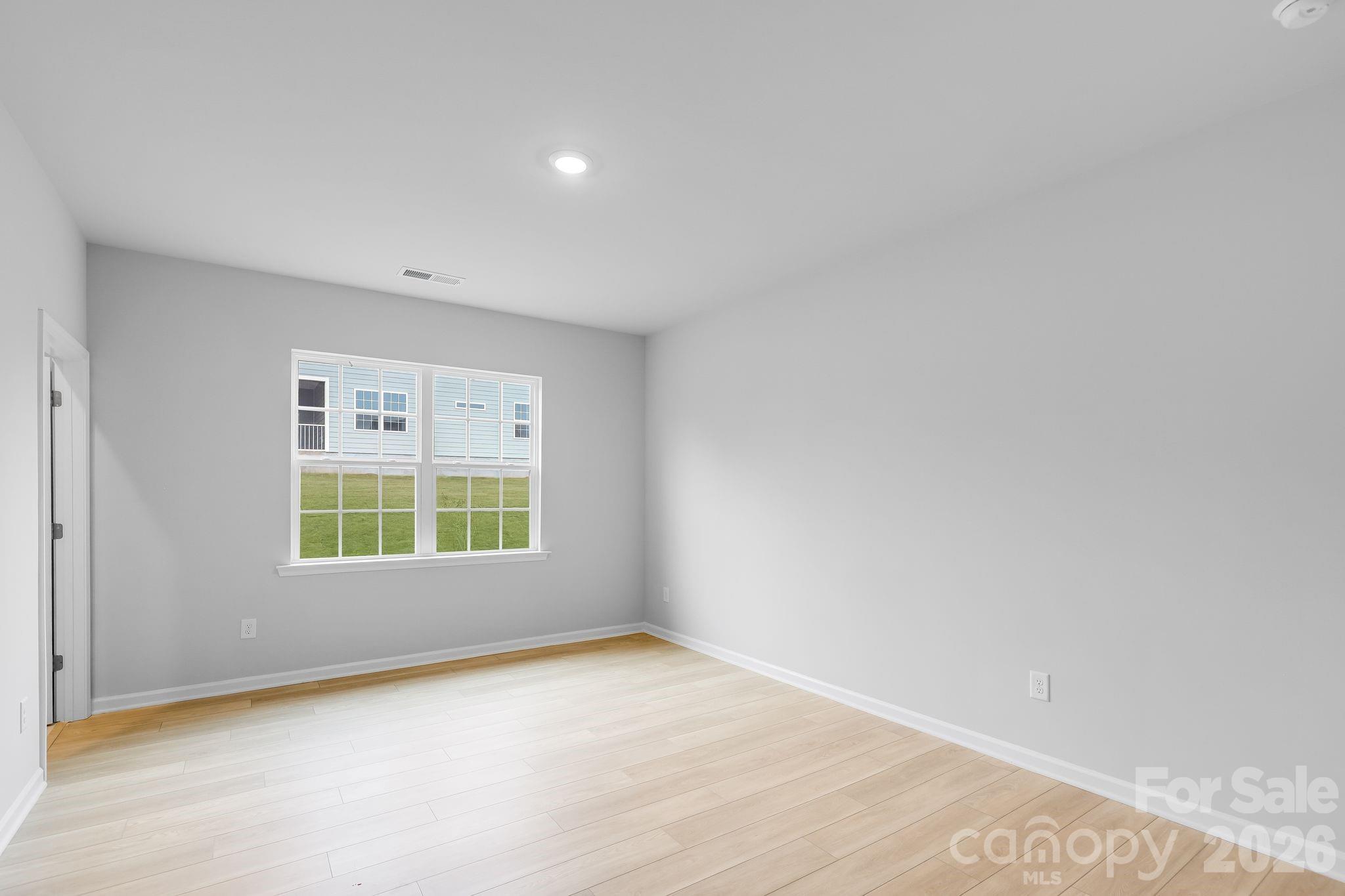3308 Amarillo Court, Unit 344 Lancaster, SC 29720 - Photo 7 of 27 an empty room with a window