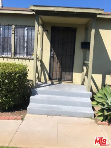 a view of staircase with a small garden