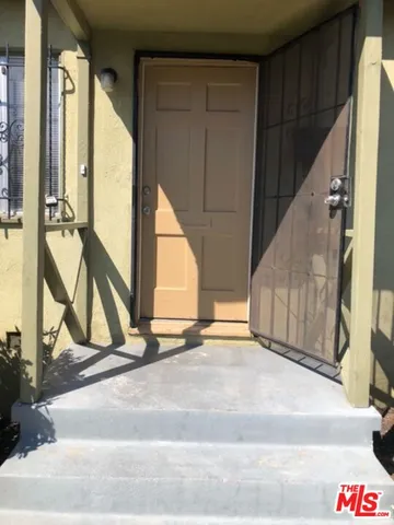 a view of an entryway with wooden floor