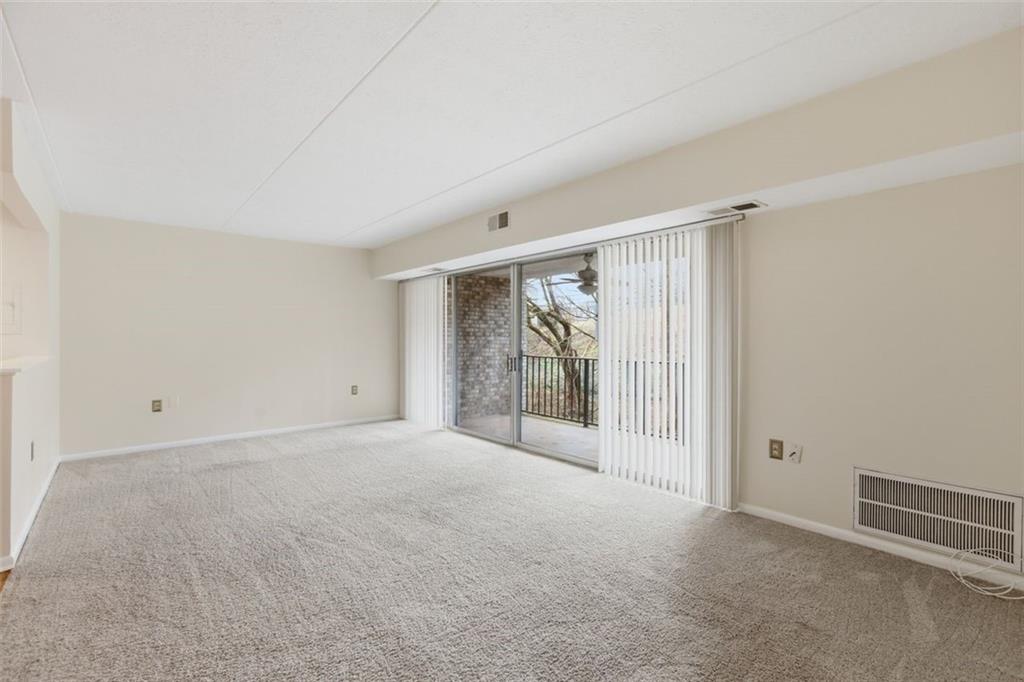 2160 Greentree Road, Unit 405W Pittsburgh, PA 15220 - Photo 8 of 32 a view of empty room with floor to ceiling window