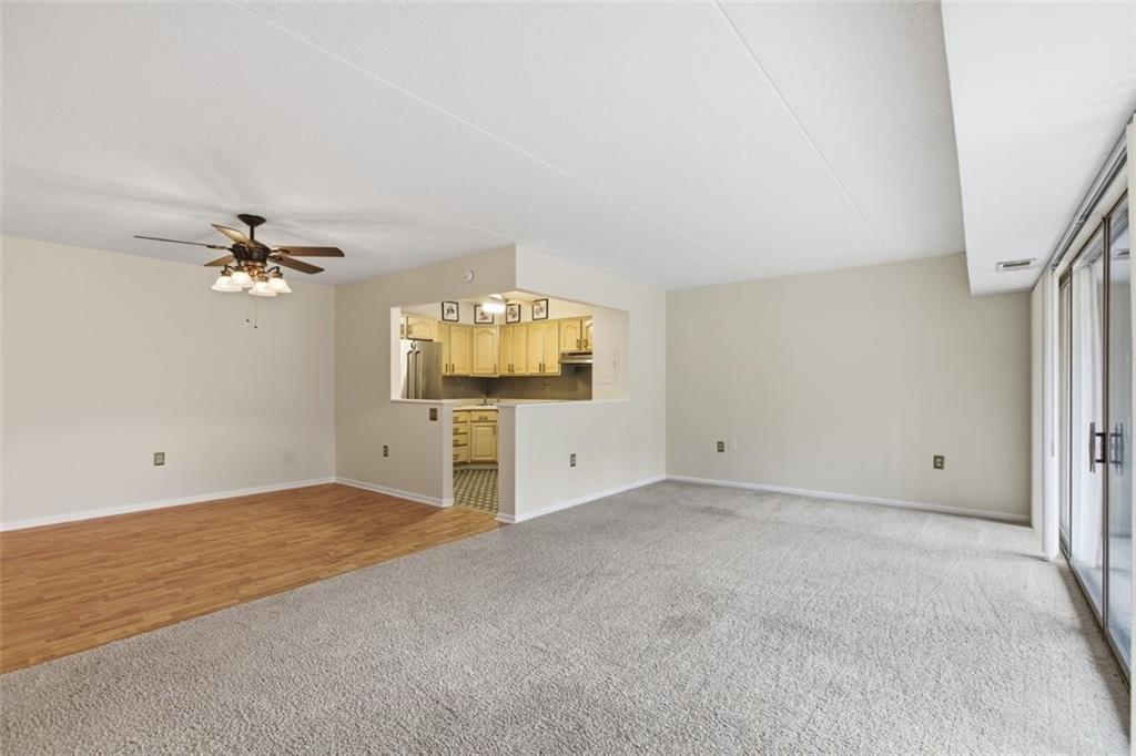 2160 Greentree Road, Unit 405W Pittsburgh, PA 15220 - Photo 9 of 32 wooden floor in an empty room with a window
