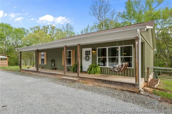 a front view of a house with a porch