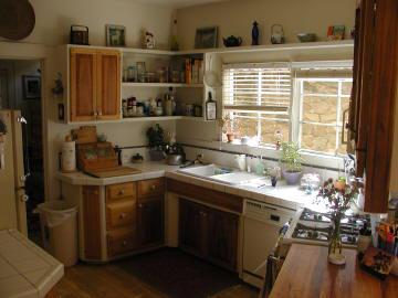 The kitchen has charm and character and opens to the dining room.