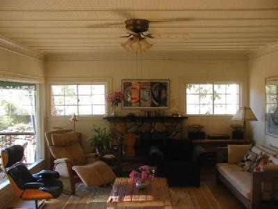 1400 McAndrew Road, Unit 5 Ojai, CA 93023 - Photo 8 of 10 The original 1920 living room has been updated by basically remains the same with lovely wood floors opening onto a large deck.