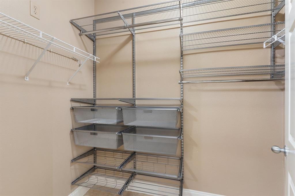 3102 Kings Road, Unit 1106 Dallas, TX 75219 - Photo 15 of 20 a view of a room with racks on the wall