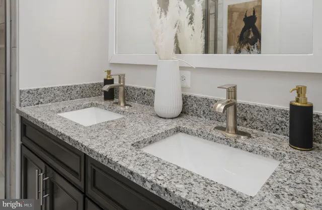 a bathroom with sink and mirror