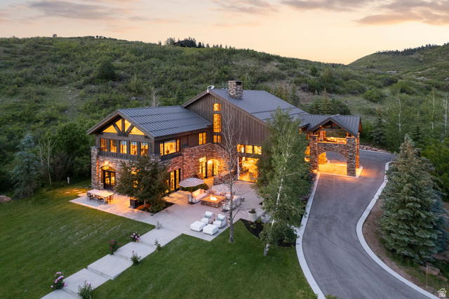 5971 Maple Ridge Trail Oakley, UT 84055 - Photo 36 of 43 Stone and wood-sided architectural residence featuring a prominent porte-cochère