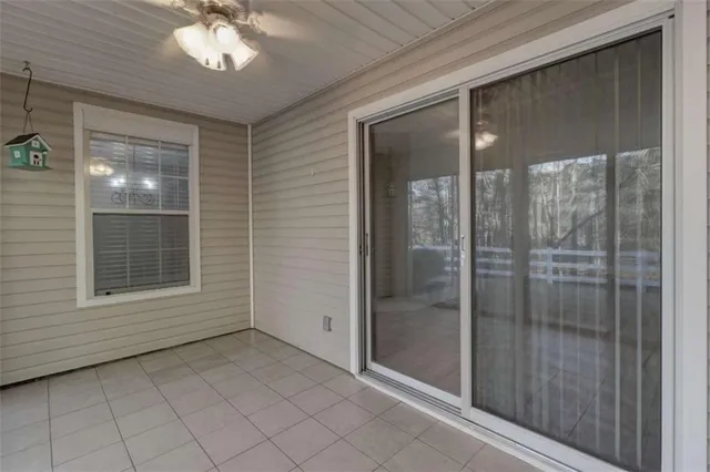 a view of an empty room with a mirror