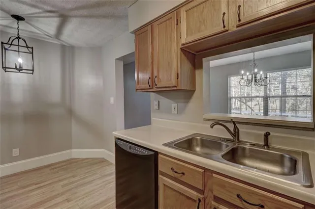 a kitchen with a sink and cabinets