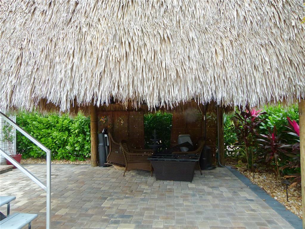 3520 Southwest 7th Manor, Unit 357 Okeechobee, FL 34974 - Photo 12 of 22 a building with potted plants in front of it