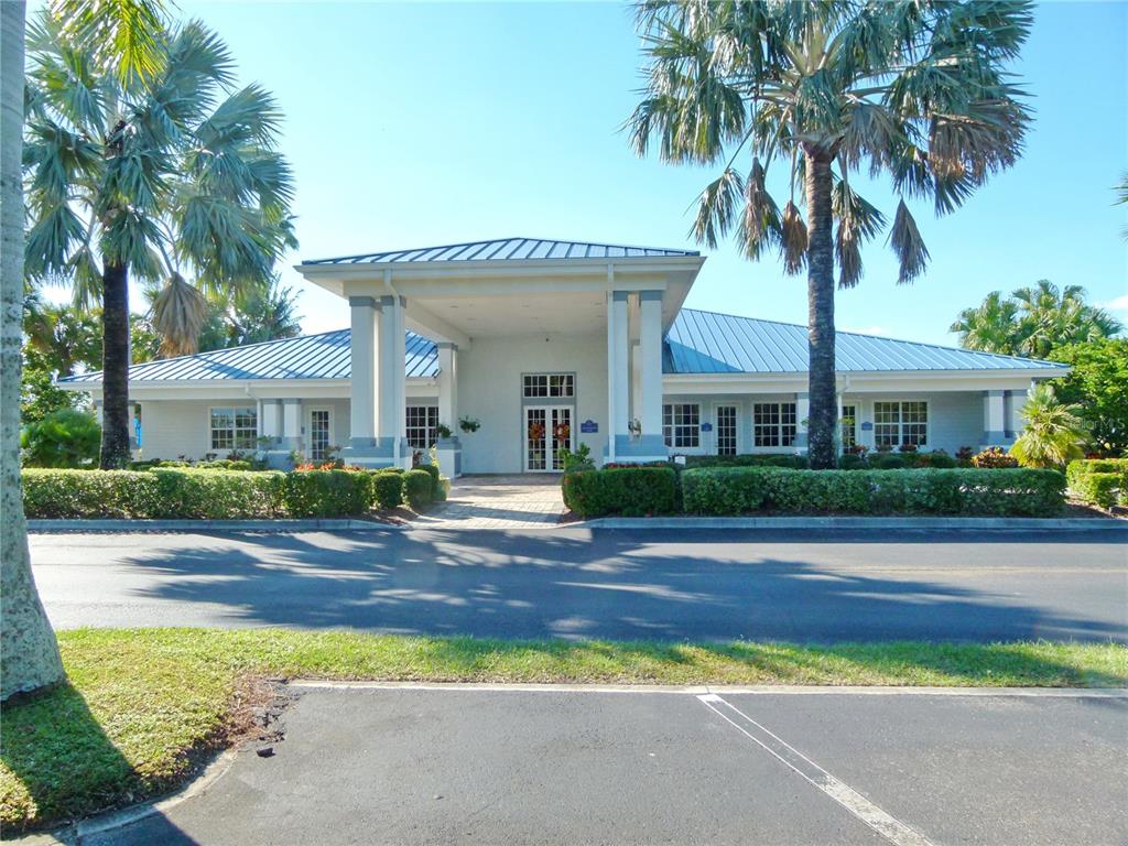3520 Southwest 7th Manor, Unit 357 Okeechobee, FL 34974 - Photo 13 of 22 a front view of a house with a yard and garage