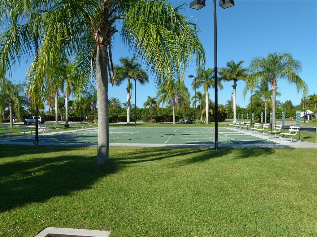 3520 Southwest 7th Manor, Unit 357 Okeechobee, FL 34974 - Photo 20 of 22 a view of a park with palm trees
