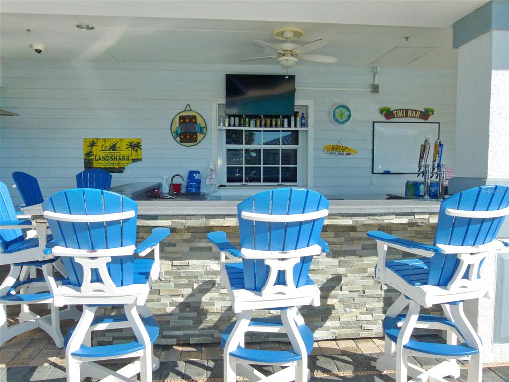 3520 Southwest 7th Manor, Unit 357 Okeechobee, FL 34974 - Photo 21 of 22 a living room with furniture and a rug