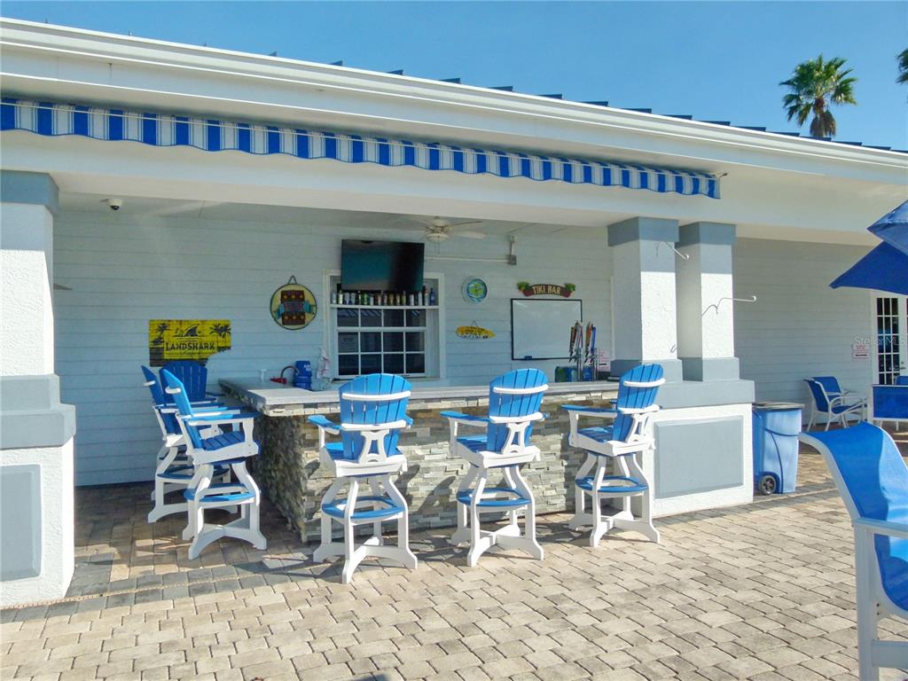3520 Southwest 7th Manor, Unit 357 Okeechobee, FL 34974 - Photo 22 of 22 a view of a dining room with furniture window and plants