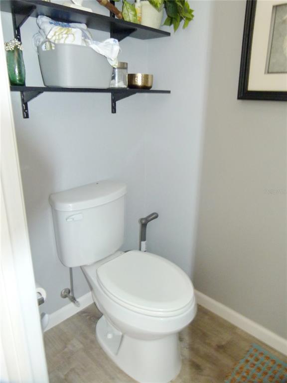 3520 Southwest 7th Manor, Unit 357 Okeechobee, FL 34974 - Photo 5 of 22 a white toilet sitting next to a shower