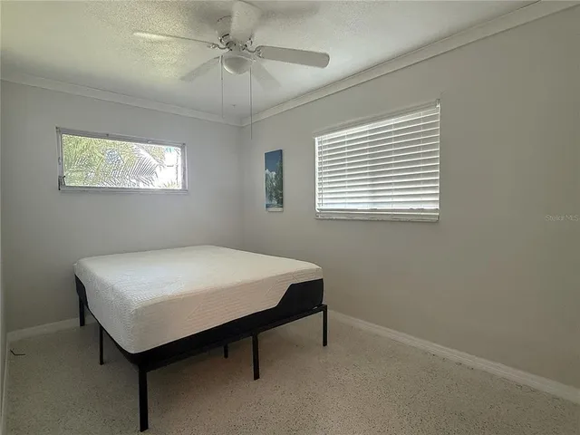 a room that has a bed and a window