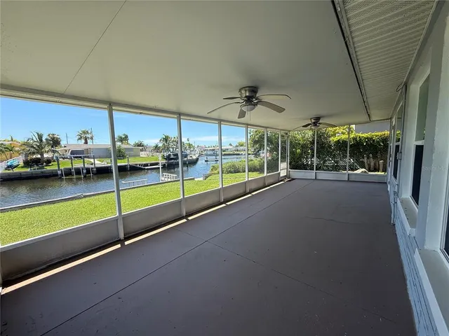 a view of a living room and balcony