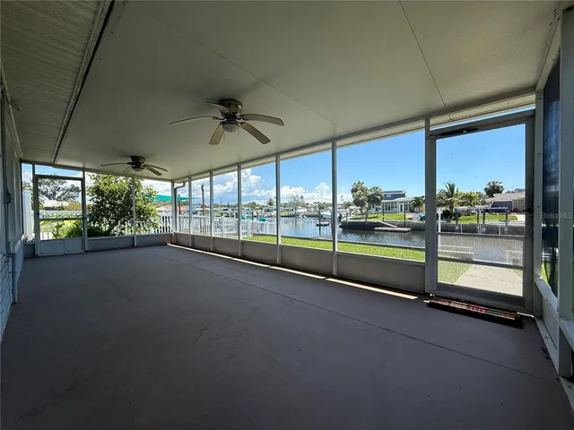 a view of an empty room with windows
