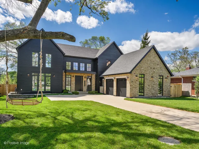 a view of a brick house with a yard