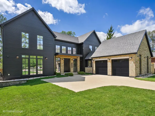 a view of a big room with a big yard and large trees