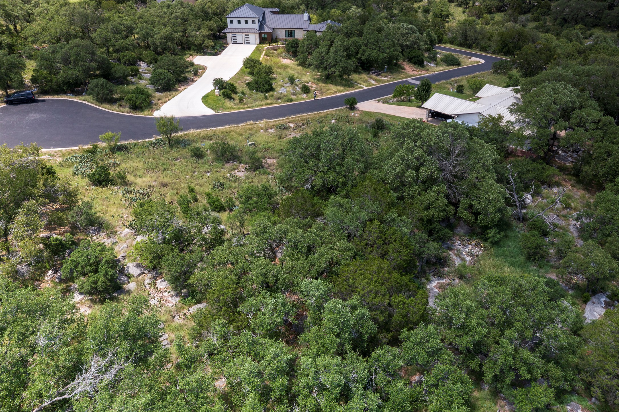 1105 Ute Road Horseshoe Bay, TX 78657 - Photo 9 of 10 Aerial view of property and surrounding area featuring a forest