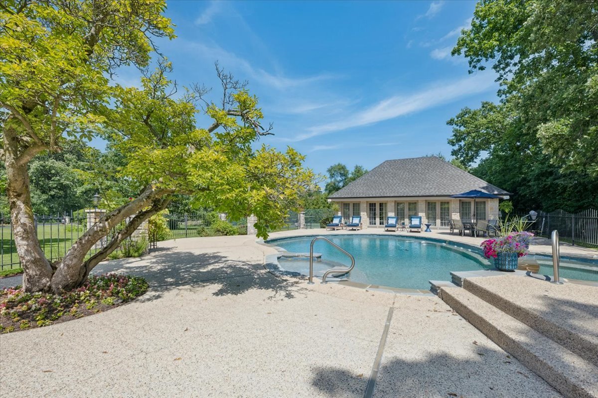 2311 Burr Oak Road Northfield, IL 60093 - Photo 41 of 69 a view of a house with pool table and chairs under an umbrella