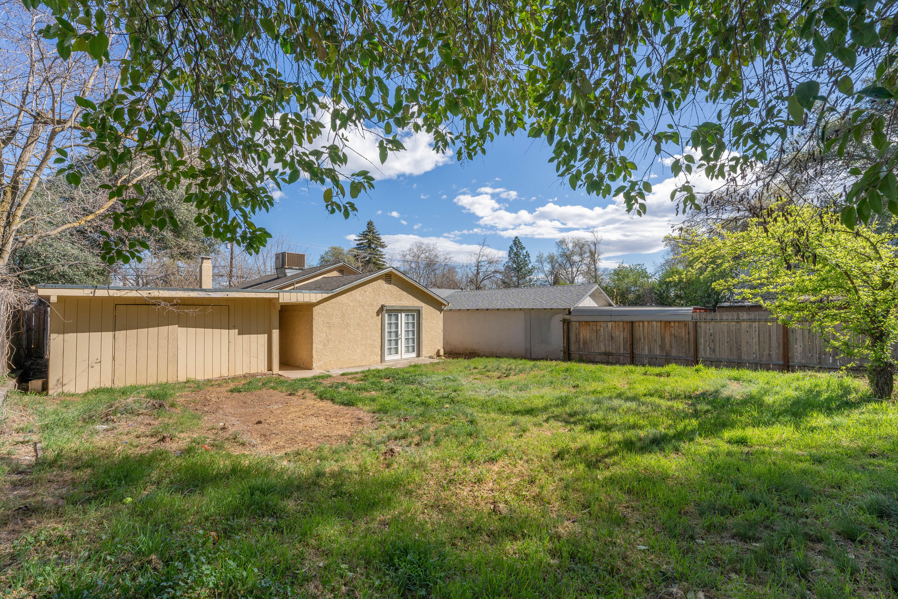 4650 Cedars Road Redding, CA 96001 - Photo 25 of 32 a view of a house with a yard and large tree