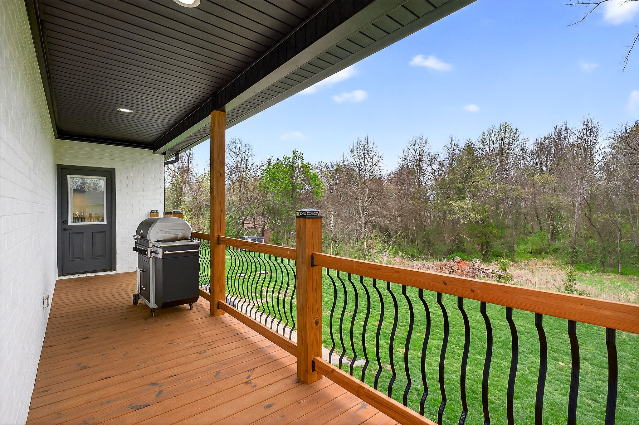 381 Rivercliff Road McMinnville, TN 37110 - Photo 26 of 46 a view of a deck with wooden floor and outdoor seating