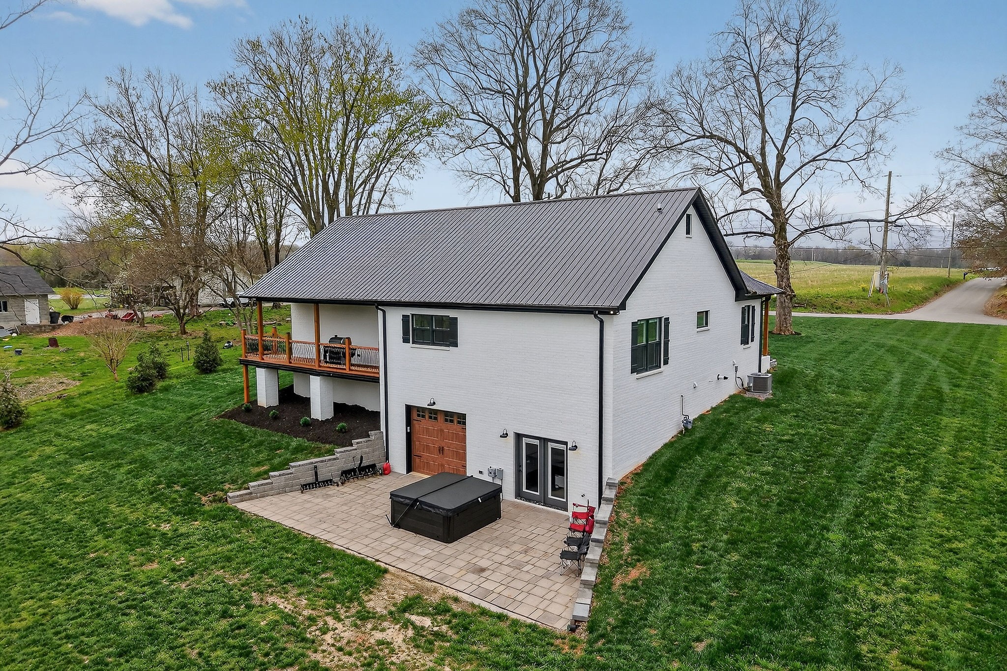 381 Rivercliff Road McMinnville, TN 37110 - Photo 30 of 46 a aerial view of a house with table and trees in the background