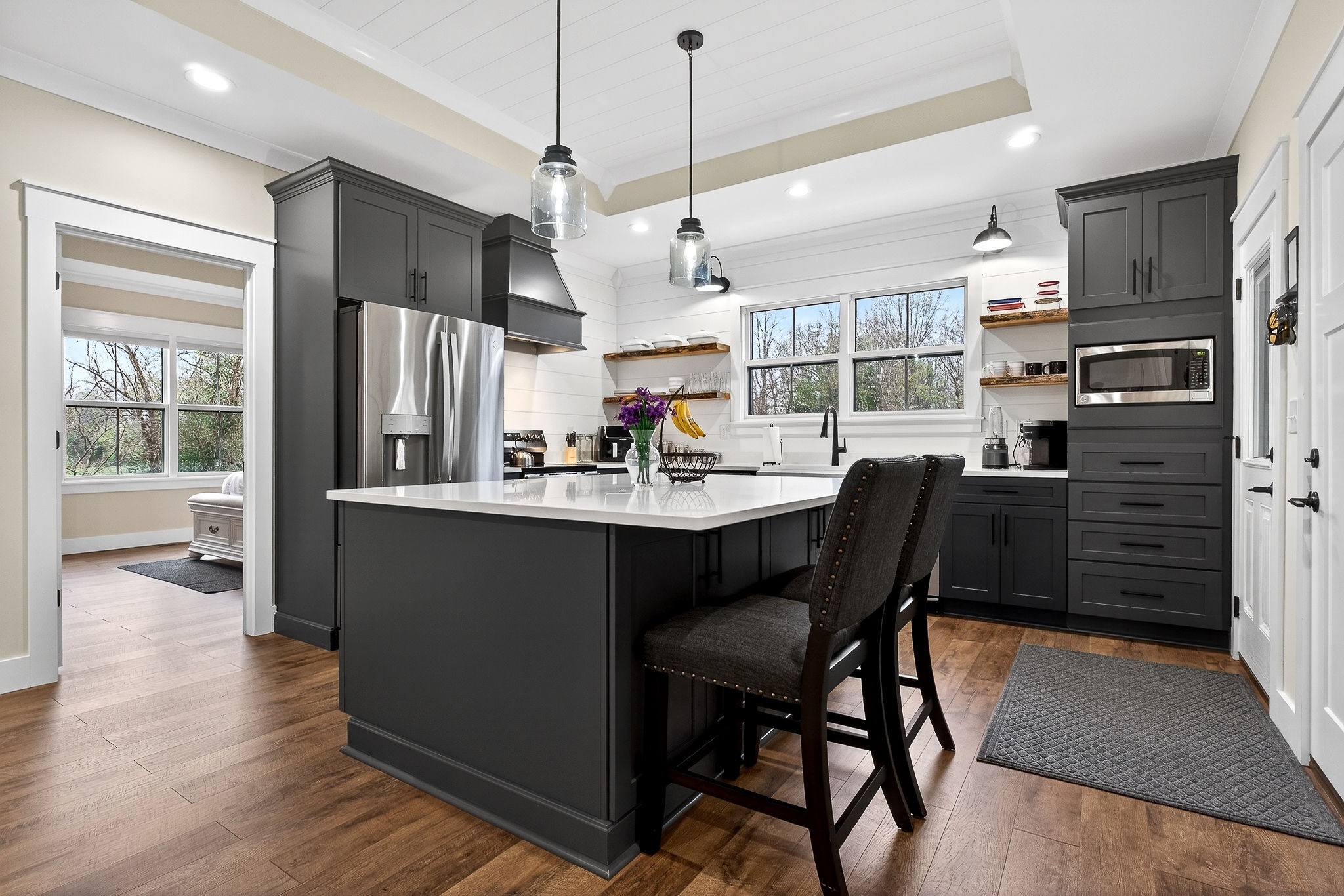 381 Rivercliff Road McMinnville, TN 37110 - Photo 10 of 46 a kitchen with a table chairs refrigerator and cabinets