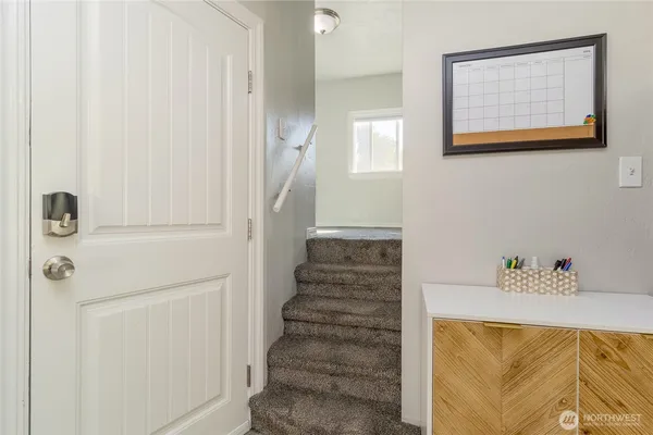 a view of a hallway with front door