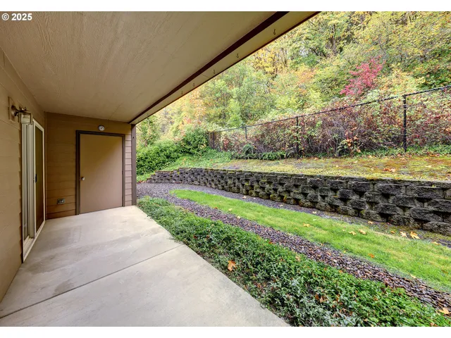 a view of a back yard from a porch