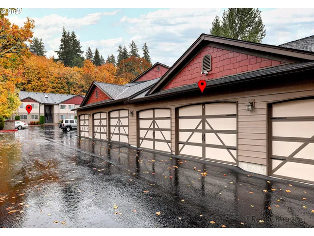 a view of house with yard and sitting area